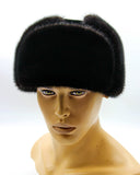 Close front view man wearing black mink suede bomber ushanka