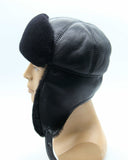 Man wearing black sheepskin ushanka three-quarter angle
