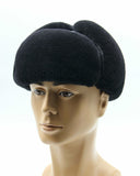 Man wearing black ushanka earflaps down side view