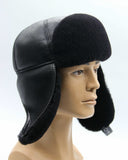 Man wearing black ushanka earflaps tied back position