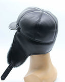 Man wearing black sheepskin visor cap earflaps down