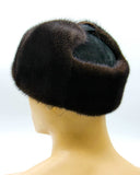 Profile view man wearing brown mink suede bomber fur hat