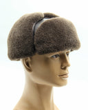 Man wearing brown sheepskin aviator hat side profile