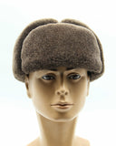 Man wearing brown sheepskin hat three-quarter angle