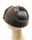 Man wearing brown sheepskin ushanka rear view