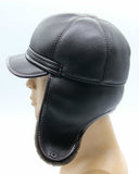 Man wearing brown visor ushanka front facing