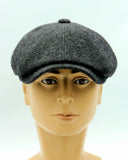 Man in green tweed newsboy cap eight-panel slouchy hat