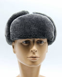 Man wearing grey sheepskin ushanka front facing