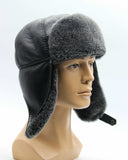 Man wearing grey sheepskin ushanka side view
