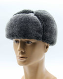 Man wearing grey sheepskin ushanka side profile