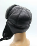 Man wearing grey ushanka earflaps down rear view