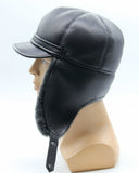 Man wearing grey sheepskin visor fur cap side view
