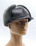 Man wearing grey sheepskin visor cap side profile