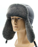 Man wearing sheepskin trapper hat earflaps down front
