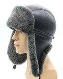 Man wearing sheepskin trapper hat earflaps down side