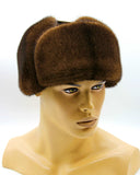 Front view man wearing brown mink fur hat suede bomber ushanka