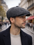 Man wearing dark gray tweed newsboy cap newsboy hat profile