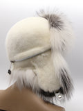 Mink hat with ear flaps up, side profile showing clean white crown and arctic fox brim