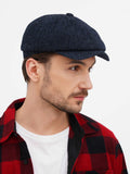 Close-up navy blue tweed newsboy cap showing 8-panel construction