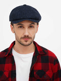 Man wearing navy blue tweed newsboy cap front view with plaid shirt