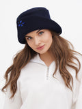 Close-up front view of navy wool cloche hat with stone accent