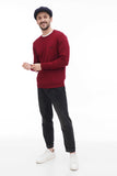 Full body shot man in dark navy tweed newsboy cap with burgundy sweater and dark jeans