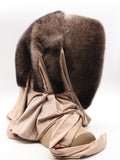 Three-quarter back view ombre mink fur hat hood with champagne fabric shawl draped across shoulders