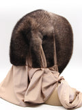 Close view ombre mink fur hat hood showing natural brown to beige gradient transition zone in mink pile