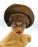Pastel brown mink beret voluminous left three-quarter view showing fuller crown height and warm caramel fur tone