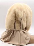 Front angled view pearl beige mink fur hat hood shawl on mannequin showing warm beige mink tone and jersey shawl coverage