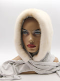 Pearl mink fur hat hood front view on mannequin showing warm beige mink surface and clean face opening