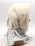 Bottom angled view pearl mink fur hat hood scarf showing grey fabric scarf end with matching pompon
