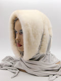 Three-quarter view pearl mink fur hat hood showing natural shimmer beige mink pile and grey fabric scarf