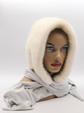 Pearl mink fur hat hood scarf on female model front view showing natural beige shimmer mink and grey fabric scarf with pompons