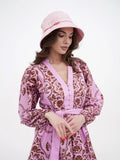 Side profile of pink cotton bucket cloche showing brim and belt