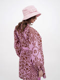 Front view of pink cotton sun hat with printed summer dress