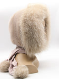 Top view powder pink mink fur hood on mannequin showing fox trim crown detail and mink pile surface