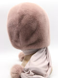 Close view powder pink mink hood showing dense flat dyed mink pile texture at face opening edge