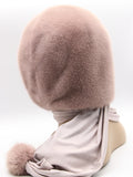 Three-quarter back view powder pink mink fur hood scarf showing coordinated mink and fabric tones with pompon