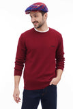 Man wearing red blue plaid flat cap standing casual pose with burgundy sweater front view