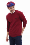 Full body shot man in red blue plaid flat cap with burgundy sweater and dark jeans