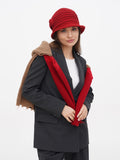 Full-length view of woman in red cloche hat and camel coat