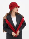Side view of red wool cloche hat with fur-trim coat collar