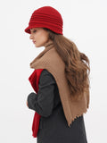 Close-up side profile of red wool cloche hat