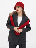 Three-quarter view of red wool cloche hat with camel coat