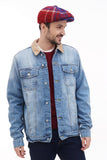 Three quarter view man wearing red blue plaid newsboy cap with denim jacket casual smile