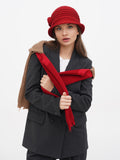 Woman wearing red wool cloche hat with camel fur-trim coat