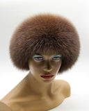 Front view of round brown fur hat with a thick cocoa arctic fox band