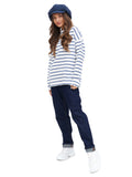 Full body view woman in royal blue baker boy cap with striped top and blue trousers