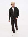 Man wearing sand beige linen newsboy cap full body side angle